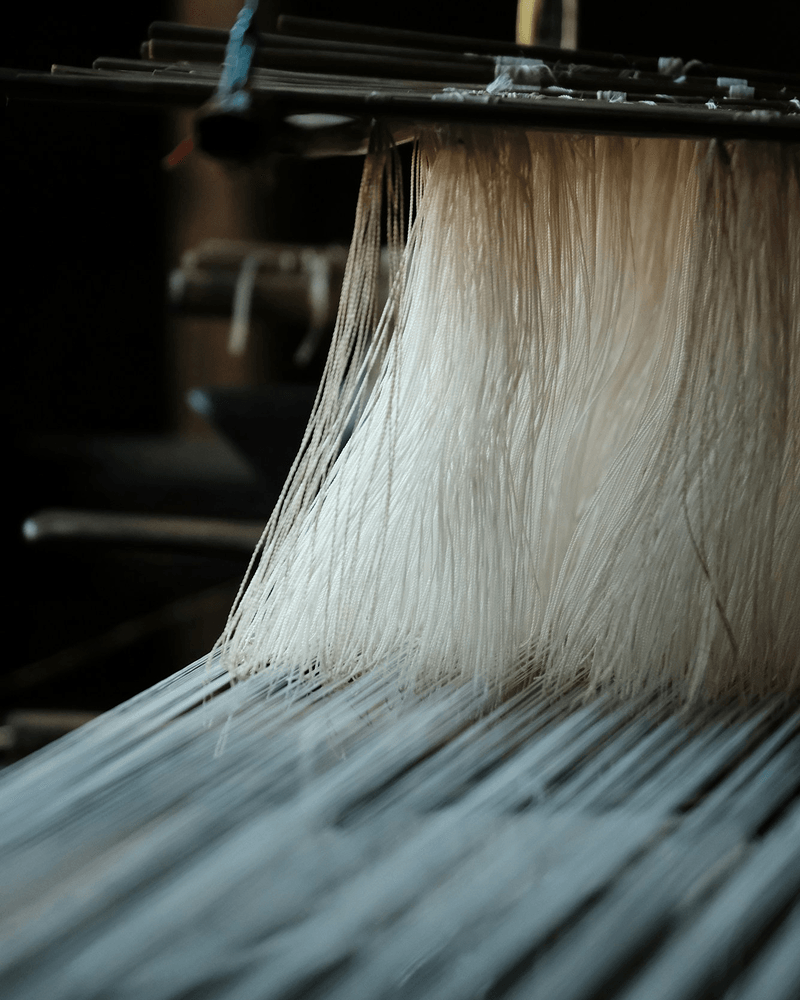 Macro view of wool on loom showing intricate weaving details